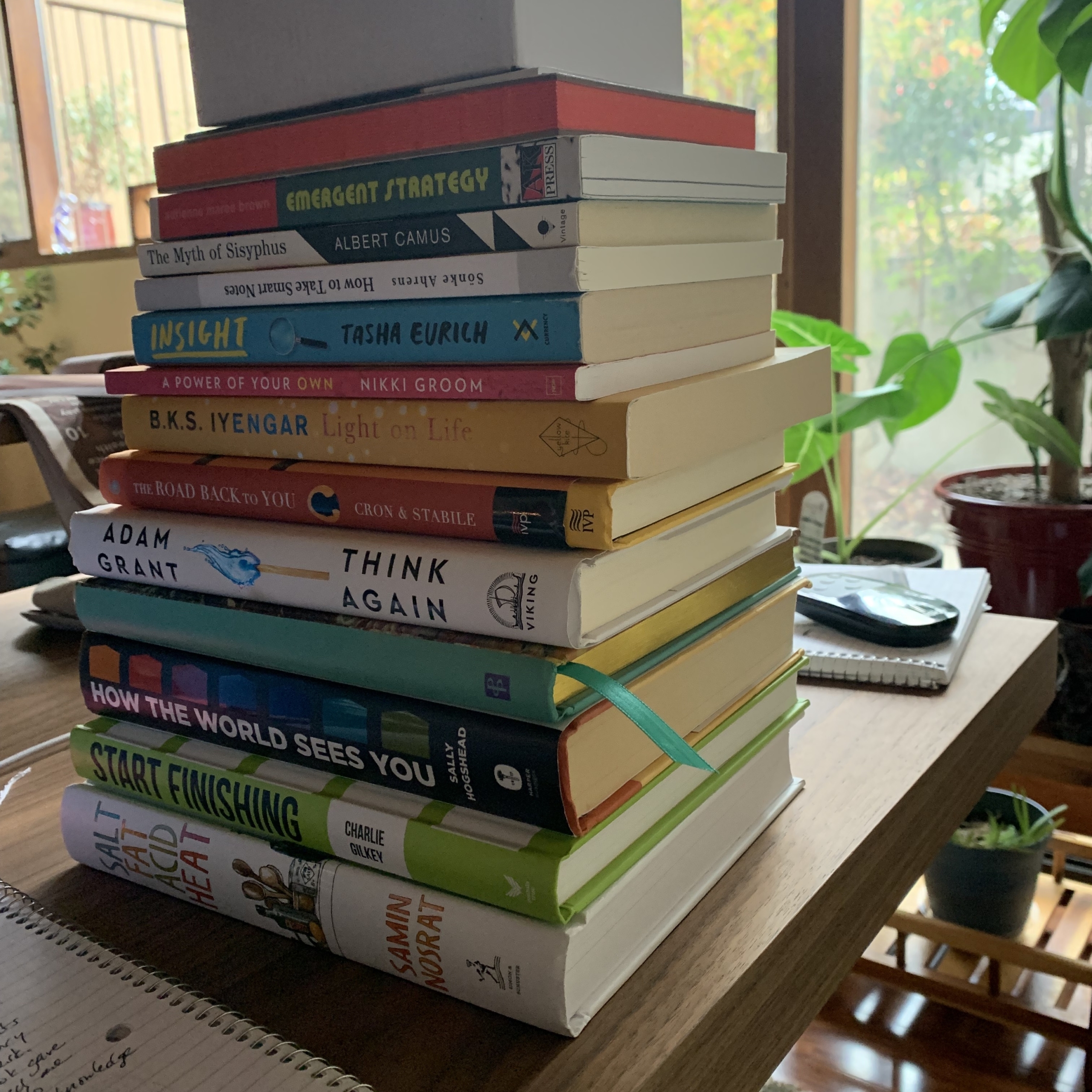 Stack of books sitting on a desk