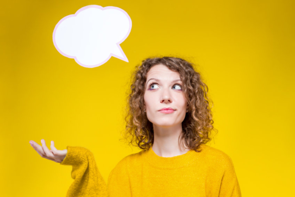 Woman in yellow with a thought bubble illustration coming out of her head.